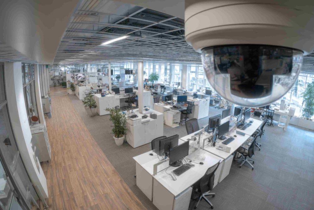 A corporate office equipped with IP cameras, emphasizing security and surveillance technology in a modern workspace environment.